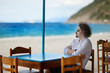 Young man relaxing in outdoor restaurant