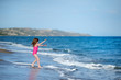 Adorable little girl on a sandy beach