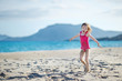 Adorable little girl on a sandy beach