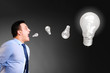 businessman is screaming bulbs
