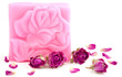 Pink bar of natural rose soap with dried purple rose buds