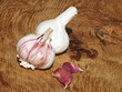 fresh garlic cloves on a wooden board from oak