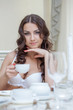 Photo: Smiling brunette posing in white brassiere Smiling brunette posing in white brassiere