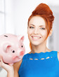 lovely woman with big piggy bank