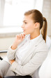 pensive woman in office