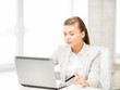 businesswoman with laptop using credit card