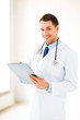 male doctor writing prescription