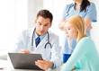 Photo: male doctor with patient male doctor with patient