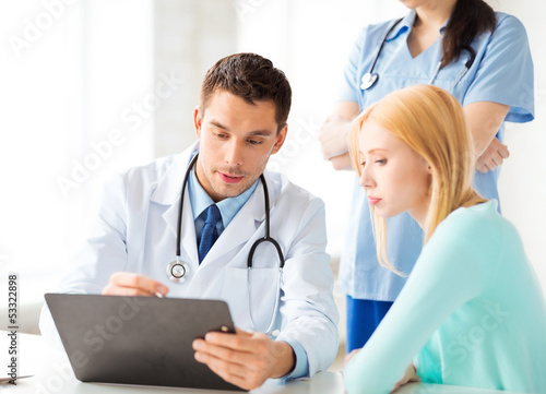 Photo: male doctor with patient male doctor with patient