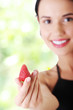 Foto: Happy young woman with strawberry. Happy young woman with strawberry.