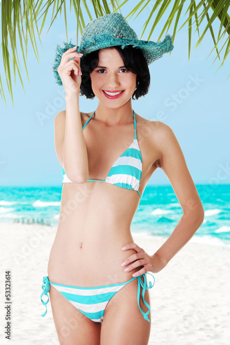 Photo: Sexy brunette woman posing in bikini Sexy brunette woman posing in bikini