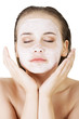Photo: Beautiful woman with clay facial mask Beautiful woman with clay facial mask