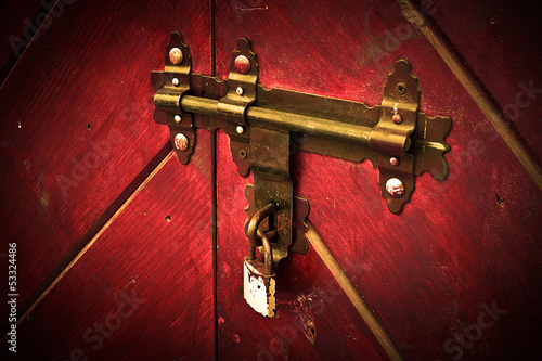 Photo: Old lock, modern padlock. Old lock, modern padlock.