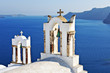 Bell towers overlooking the sea in Oia