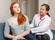 Mature physician palpates behind of patient