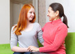 Happy mother and daughter looking at each other