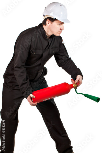 Photo: Handyman wearing uniform and hardhat Handyman wearing uniform and hardhat
