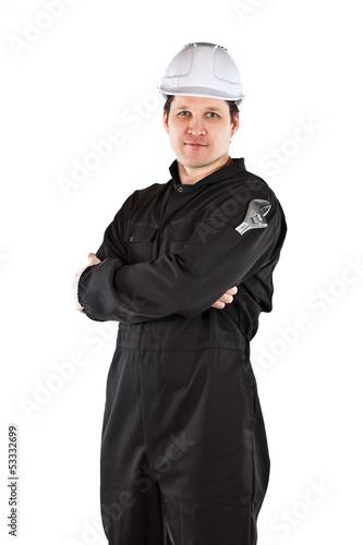 Photo: Handyman wearing uniform and hardhat Handyman wearing uniform and hardhat