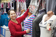 Mature woman  chooses clothes
