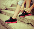 Woman trying running shoes getting ready for jogging