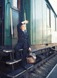 Photo: little boy with a suitcase in the retro train little boy with a suitcase in the retro train