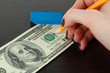 Foto: Making fake dollar on wooden background Making fake dollar on wooden background