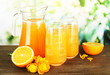 Glasses and pitcher of orange juice