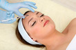 Young woman receiving plastic surgery injection