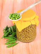 Green peas on wooden background