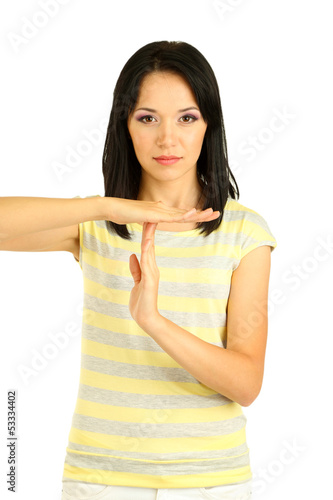 Photo: Girl showing time out sign isolated on white Girl showing time out sign isolated on white