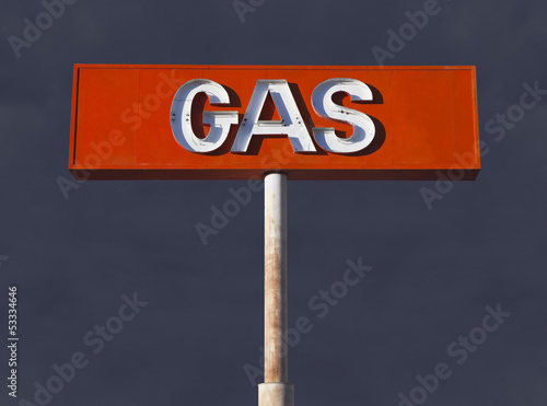 Photo: Vintage Desert Neon Gas Sign with Storm Sky Vintage Desert Neon Gas Sign with Storm Sky
