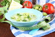 Foto: Cabbage soup in plates on napkin on wooden table Cabbage soup in plates on napkin on wooden table