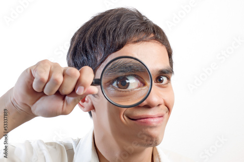 Photo: Man with a magnifying glass Man with a magnifying glass
