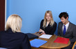 Businesswoman  Showing A Paper To A Businessman