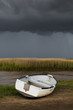 Single white rowing boat at Brancaster Norfolk England