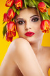 beauty woman portrait with wreath from flowers on head over yell