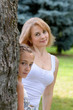 Mother and daughter  is in garden