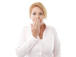 Close-up of a young woman looking surprised against white backgr