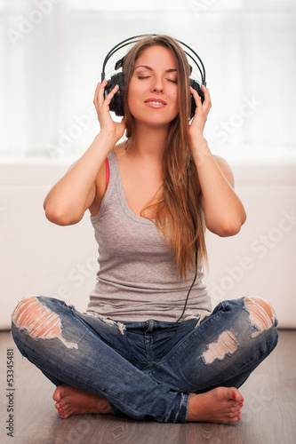 Photo: Beautiful woman enjoy music in headphones Beautiful woman enjoy music in headphones