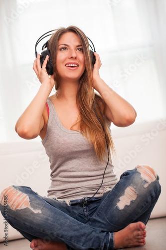 Photo: Beautiful woman enjoy music in headphones Beautiful woman enjoy music in headphones