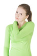 Young woman holding hand on her neck.