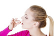 Blond woman taking pill