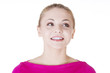 Shocked and excited woman looking up