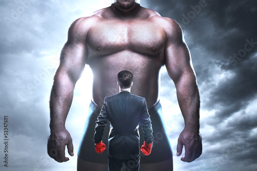Photo: businessman boxing businessman boxing