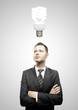 businessman and energy-saving lamp