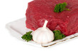 Raw sliced meat with garlic