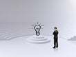 businessman looking on lamp