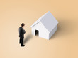 man looking at house
