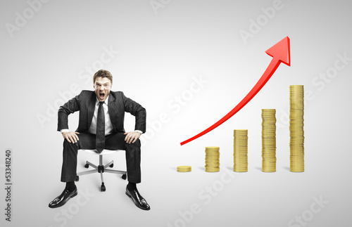 Photo: man sitting on chair and coins man sitting on chair and coins
