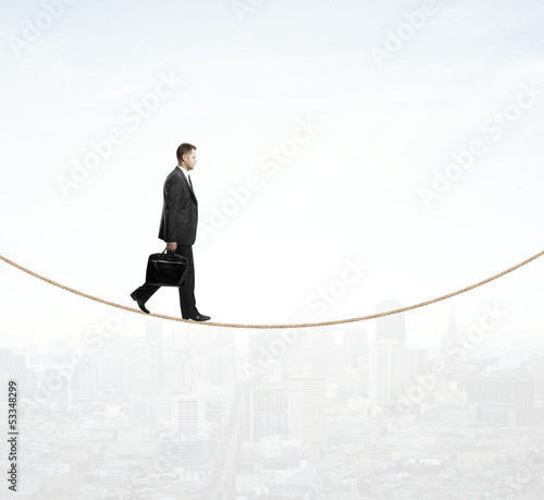 Photo: man walking on a rope man walking on a rope